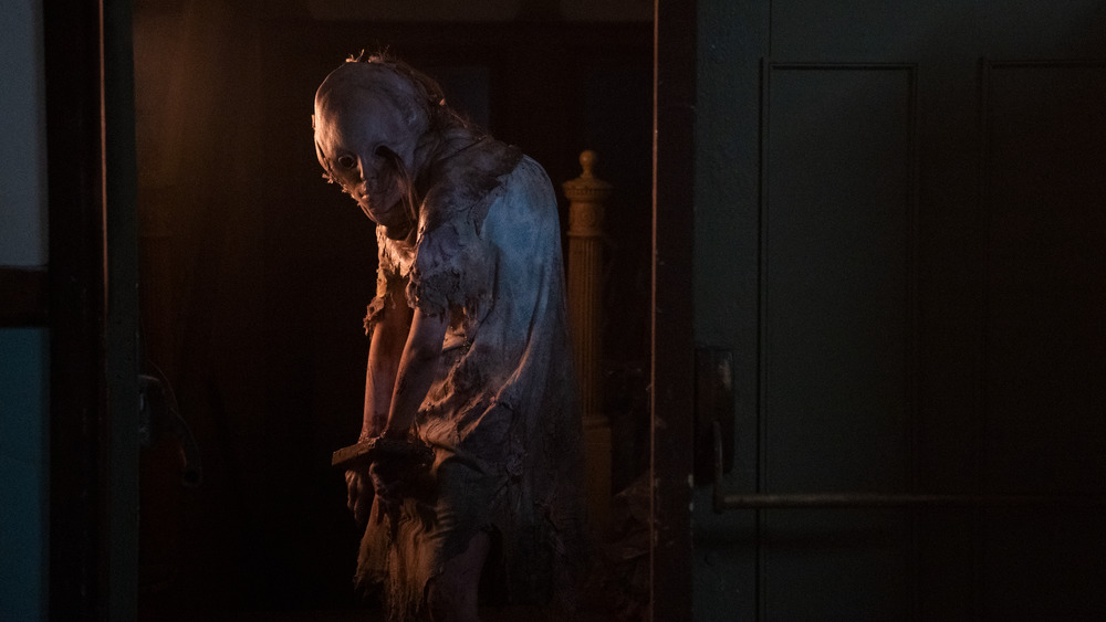 Lisa Trevor in Resident Evil: Welcome to Raccoon City.